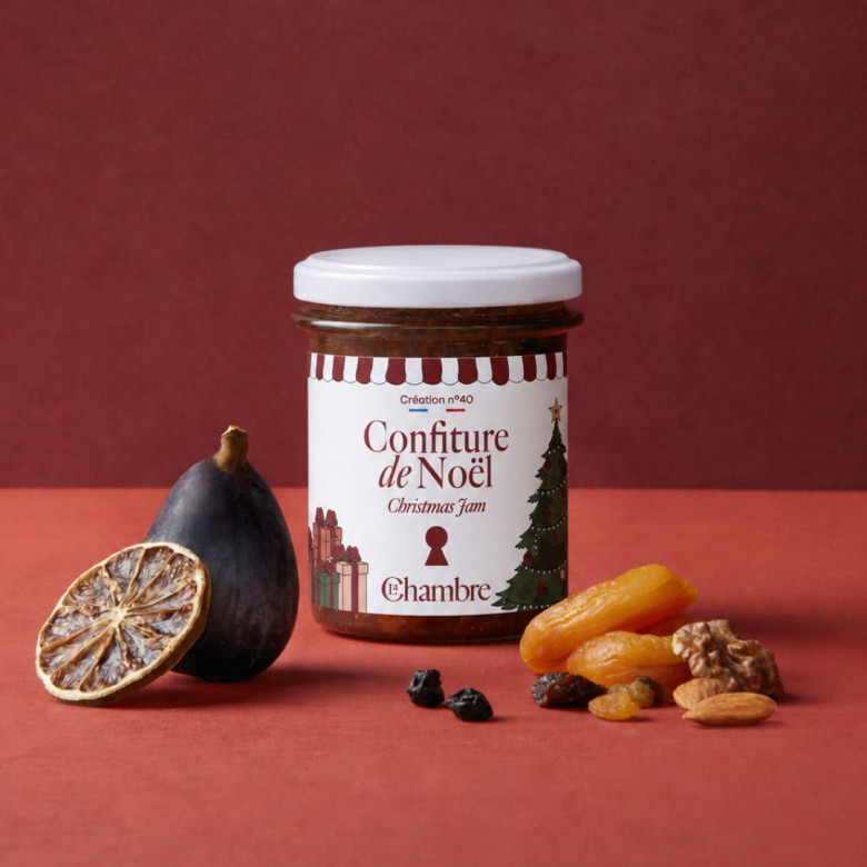 Jar of La Chambre's Christmas jam, surrounded by a fig, a dried orange slice, dried apricots and walnuts