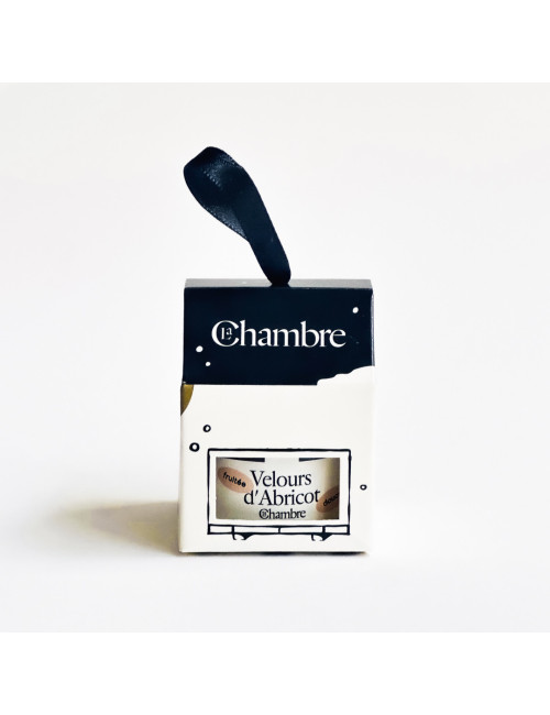 La Chambre Christmas ornament: navy box with a ribbon, the Velvet Apricot jam jar visible through the window
