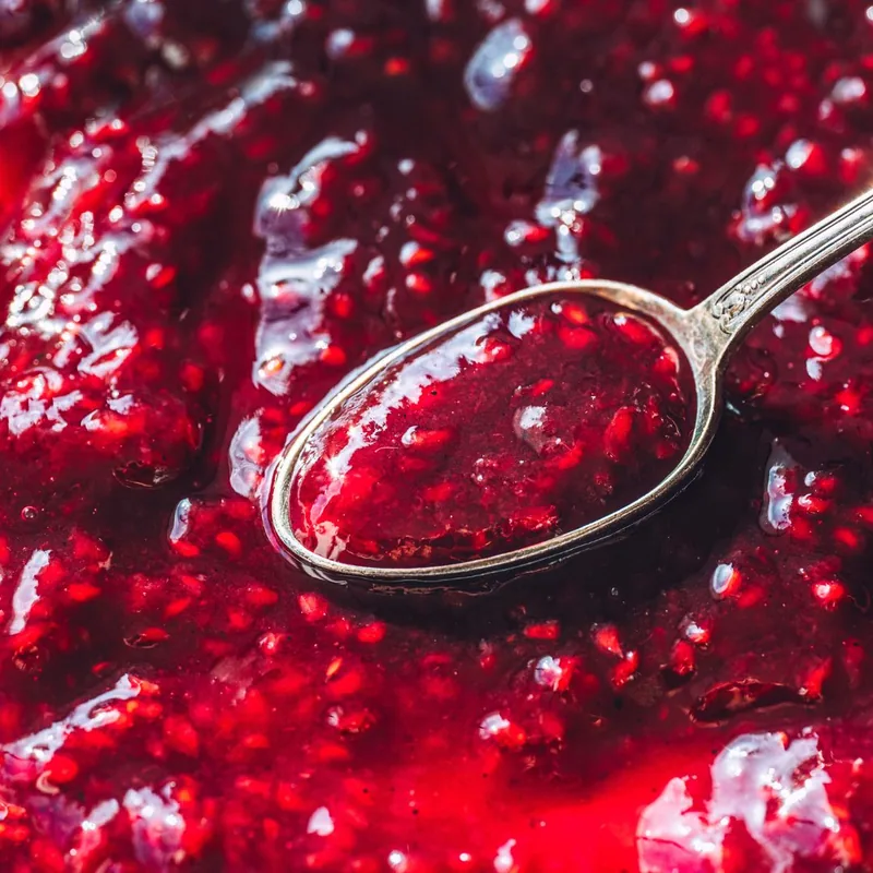 Close-up of a spoonful of raspberry jam