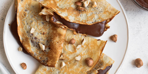 Delicious Crepes with Hazelnut Spread and Crunchy Hazelnut Pieces