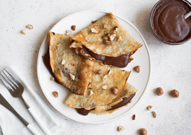 Delicious Crepes with Hazelnut Spread and Crunchy Hazelnut Pieces